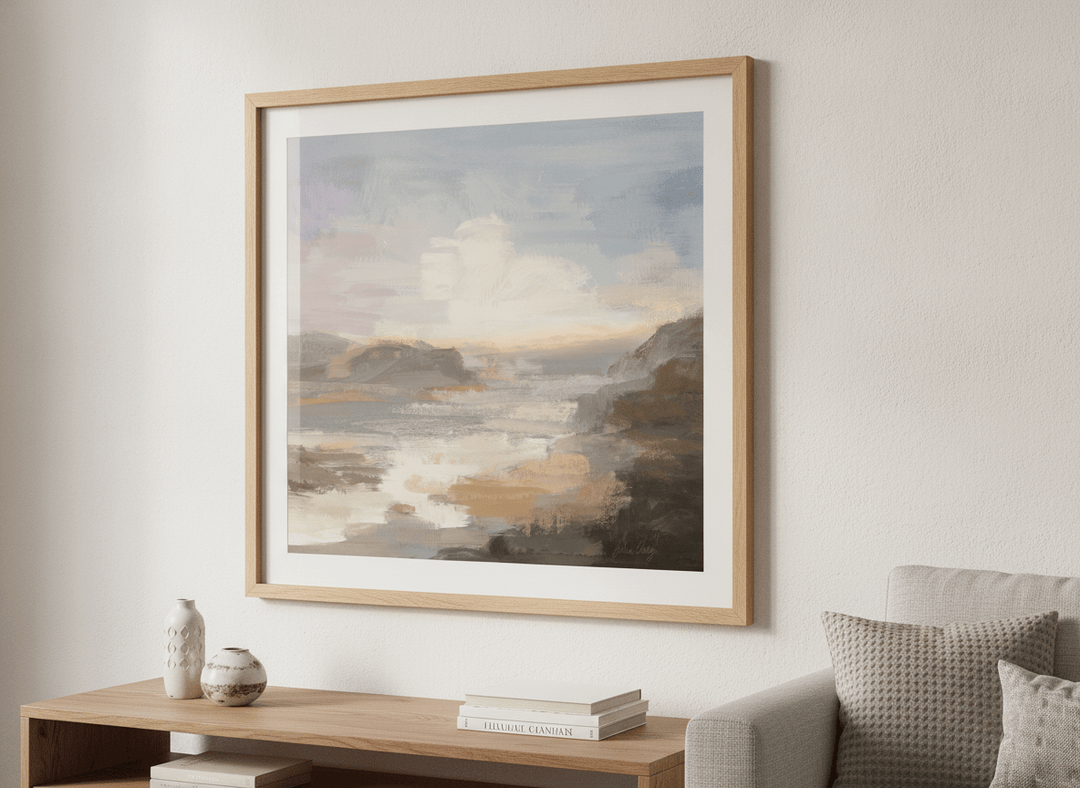 Modern wall art styled above a sofa in a neutral living room