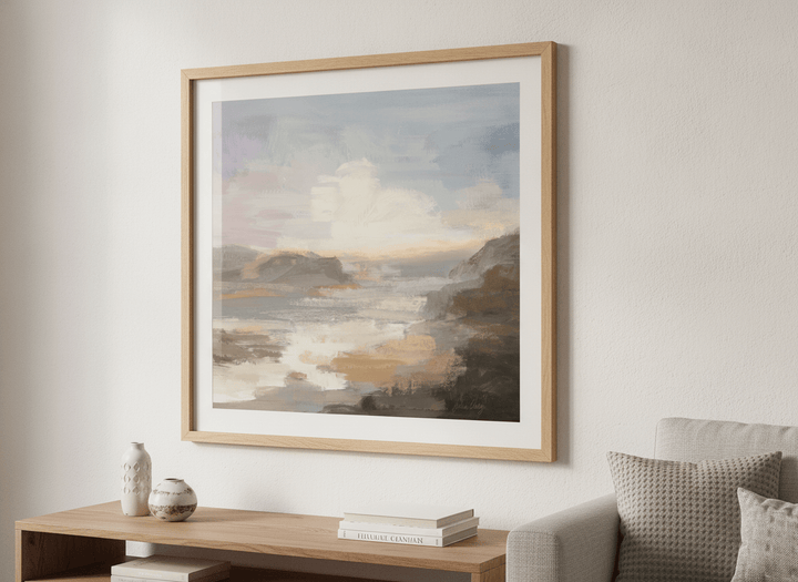 Modern wall art styled above a sofa in a neutral living room