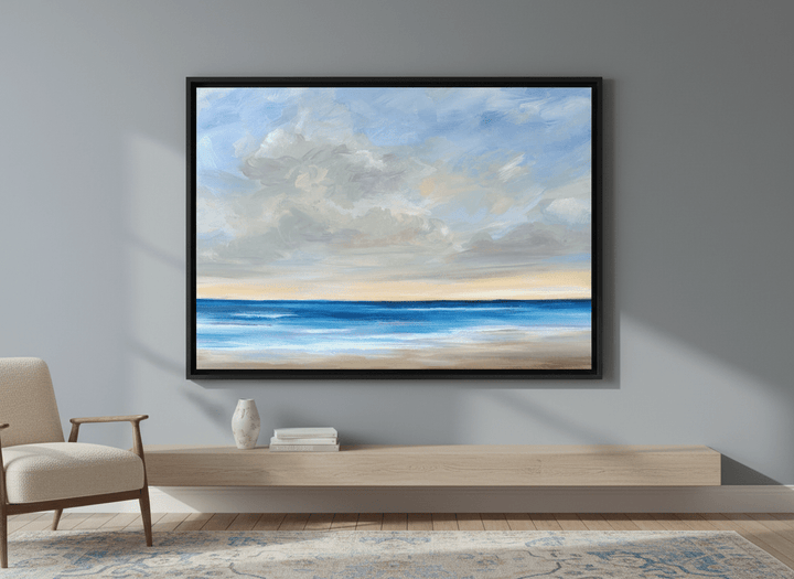 Modern wall art styled above a sofa in a neutral living room