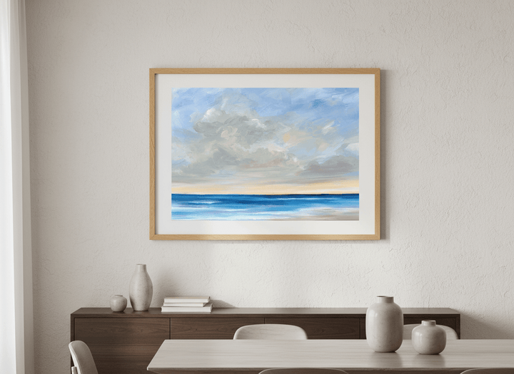 Wall art styled above a dining table in a contemporary home