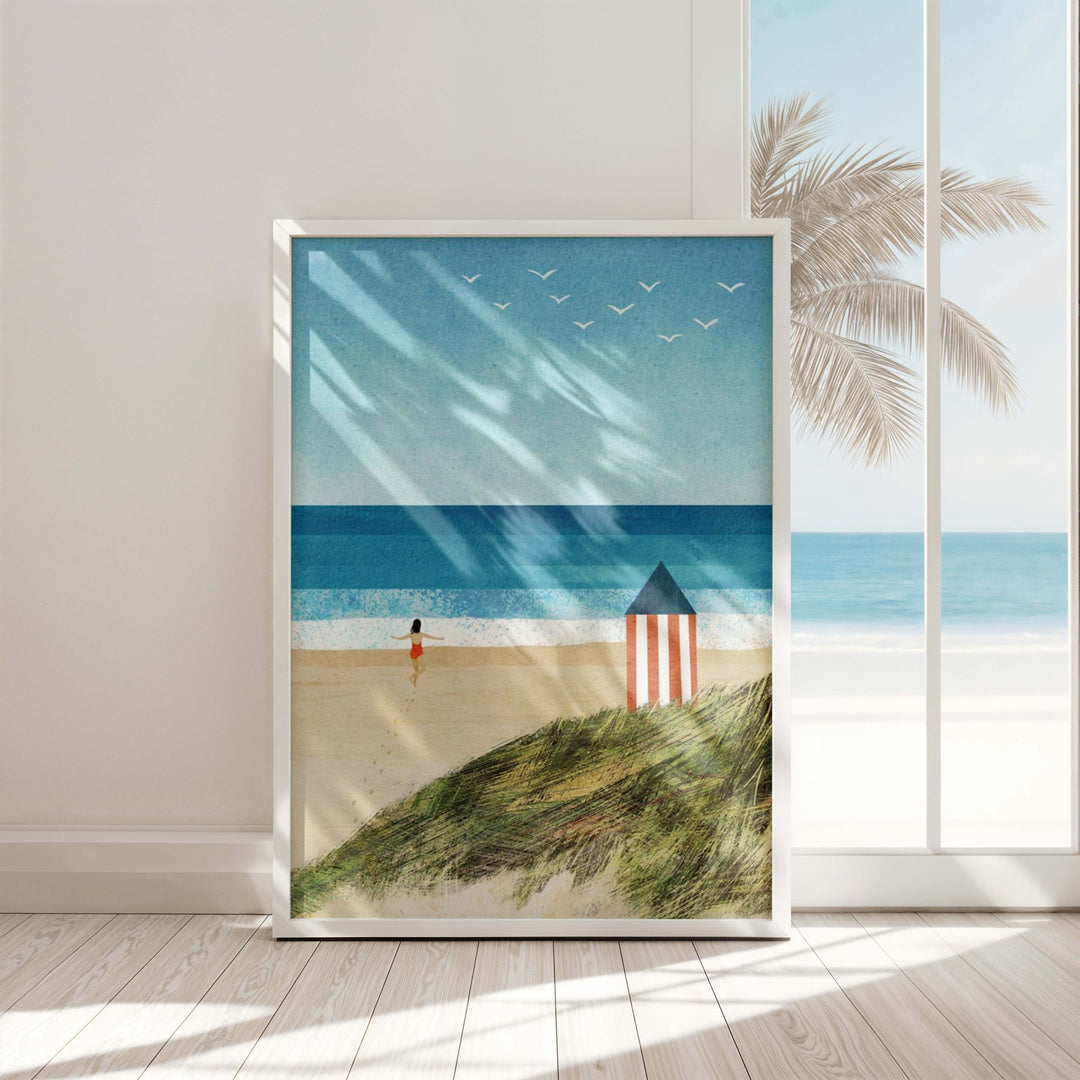 Beach scene print with a striped hut and person on a sandy beach.