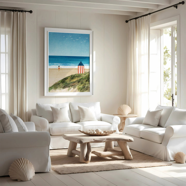 Living room with white furniture, a beach scene painting, and natural light.