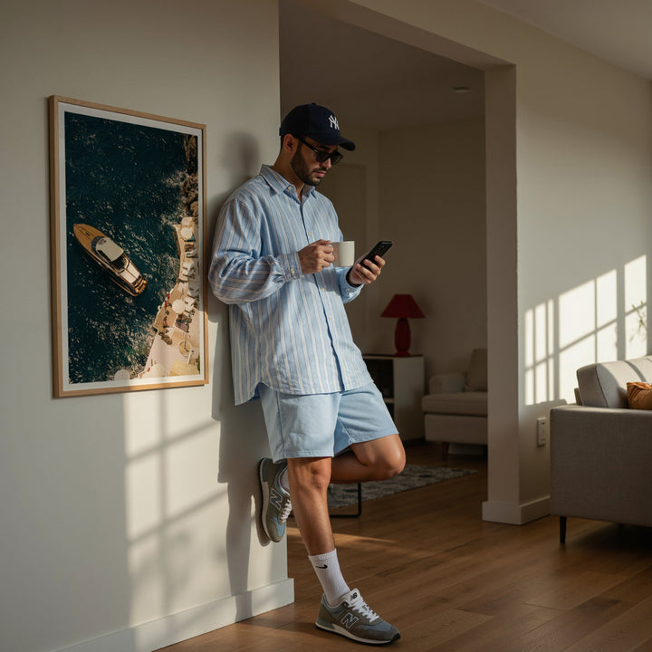 guy standing with cup in hand