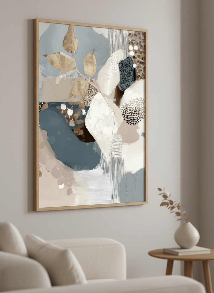 Modern wall art styled above a sofa in a neutral living room