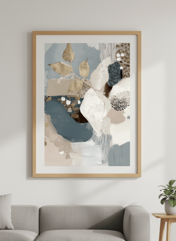Modern wall art styled above a sofa in a neutral living room