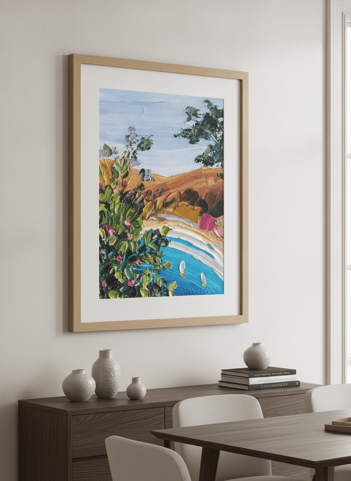 Wall art styled above a dining table in a contemporary home