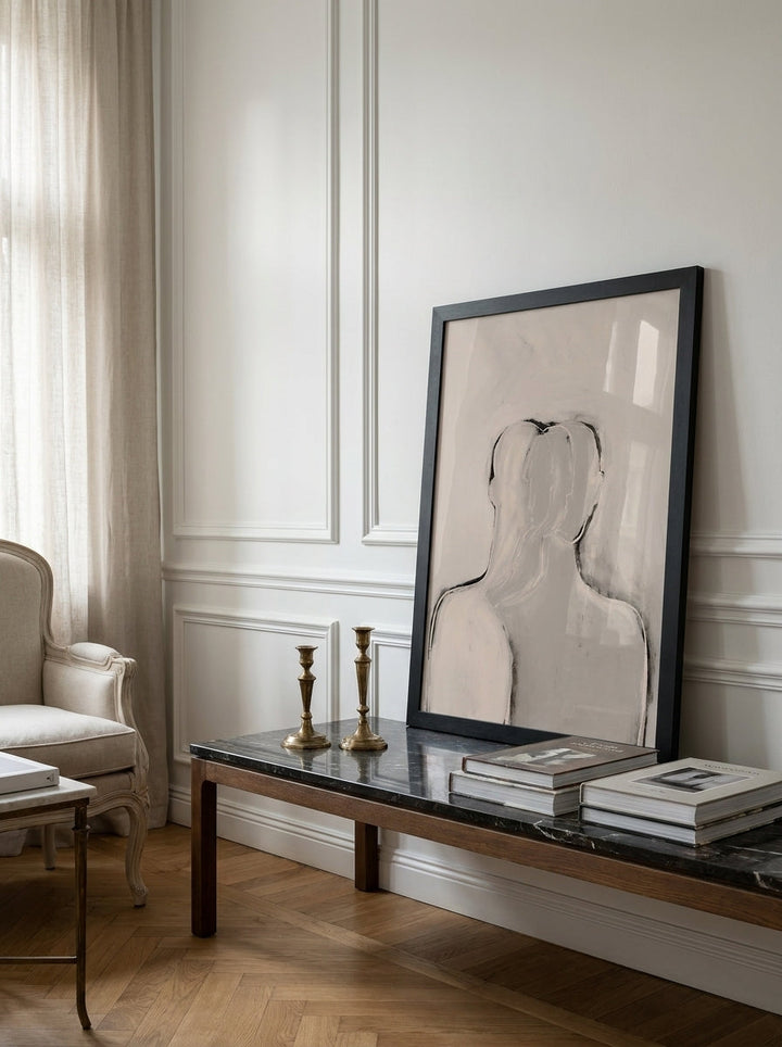 Modern wall art print standing on a console in a Parisian bedroom