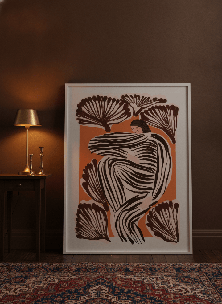 Modern wall art print leaning against the wall in a moody bedroom