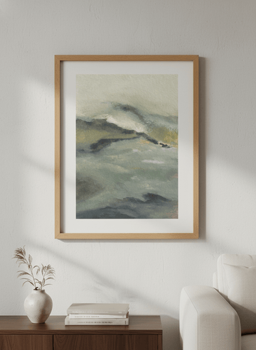 Modern wall art styled above a sofa in a neutral living room