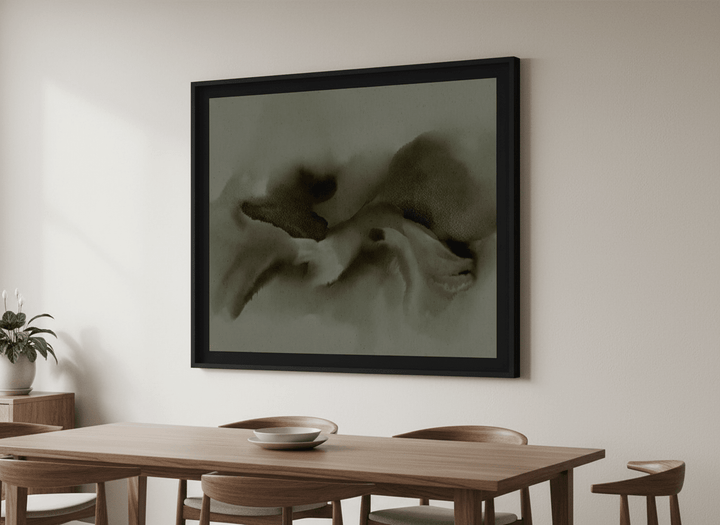 Wall art styled above a dining table in a contemporary home