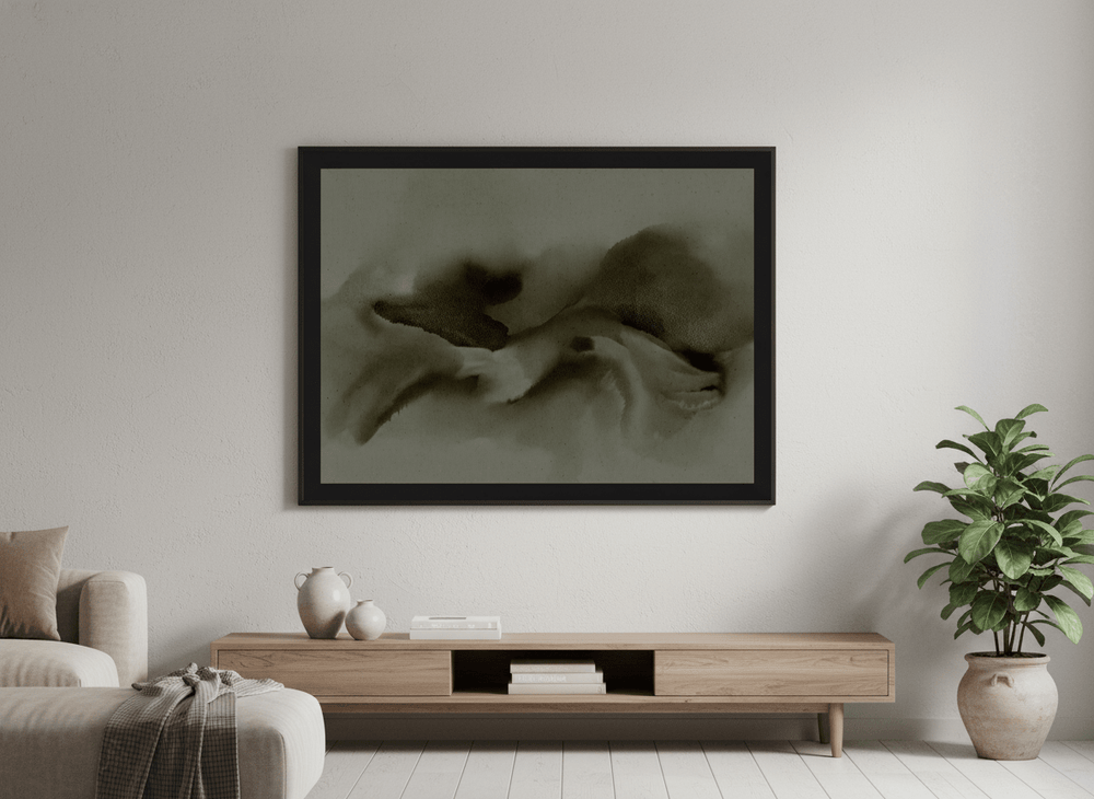 Modern wall art styled above a sofa in a neutral living room