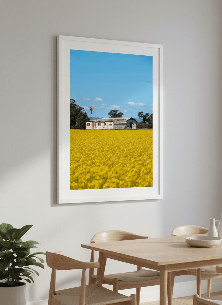 Wall art styled above a dining table in a contemporary home