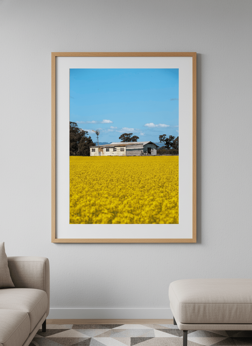Modern wall art styled above a sofa in a neutral living room