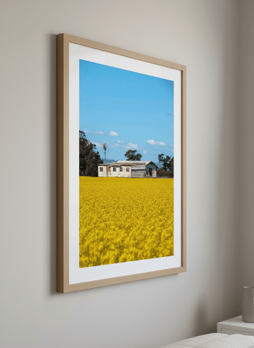 Minimalist artwork displayed in a calm, light-filled bedroom interior