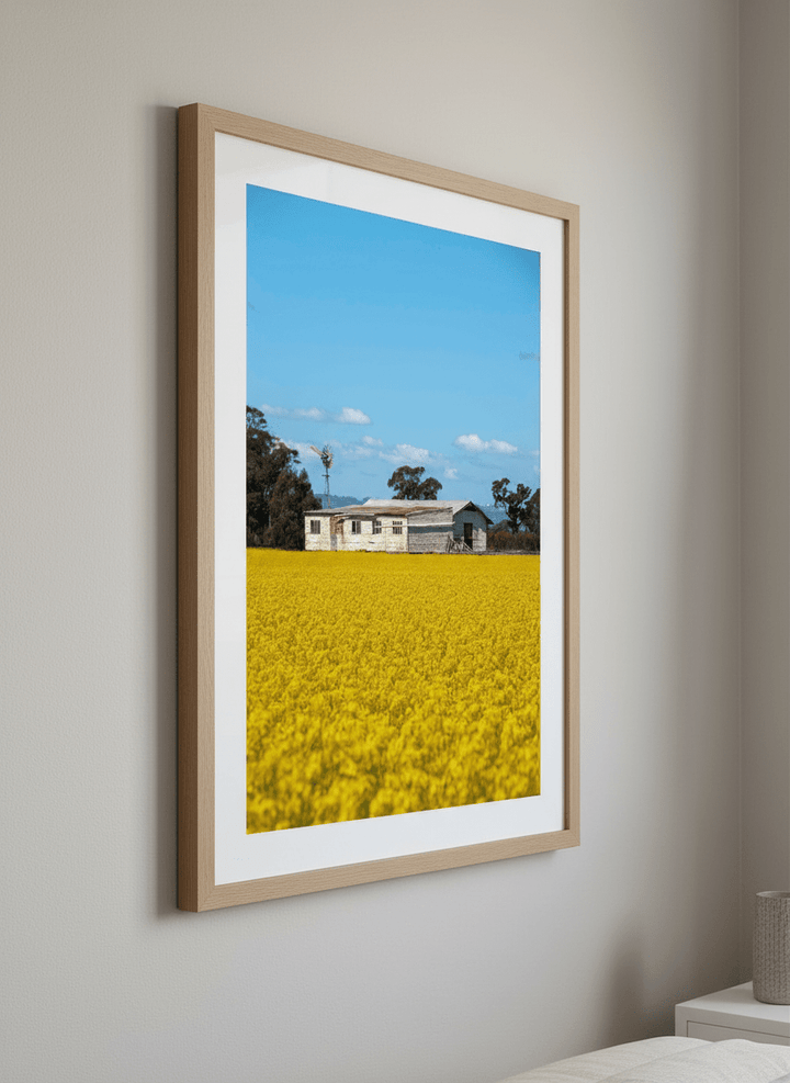 Minimalist artwork displayed in a calm, light-filled bedroom interior