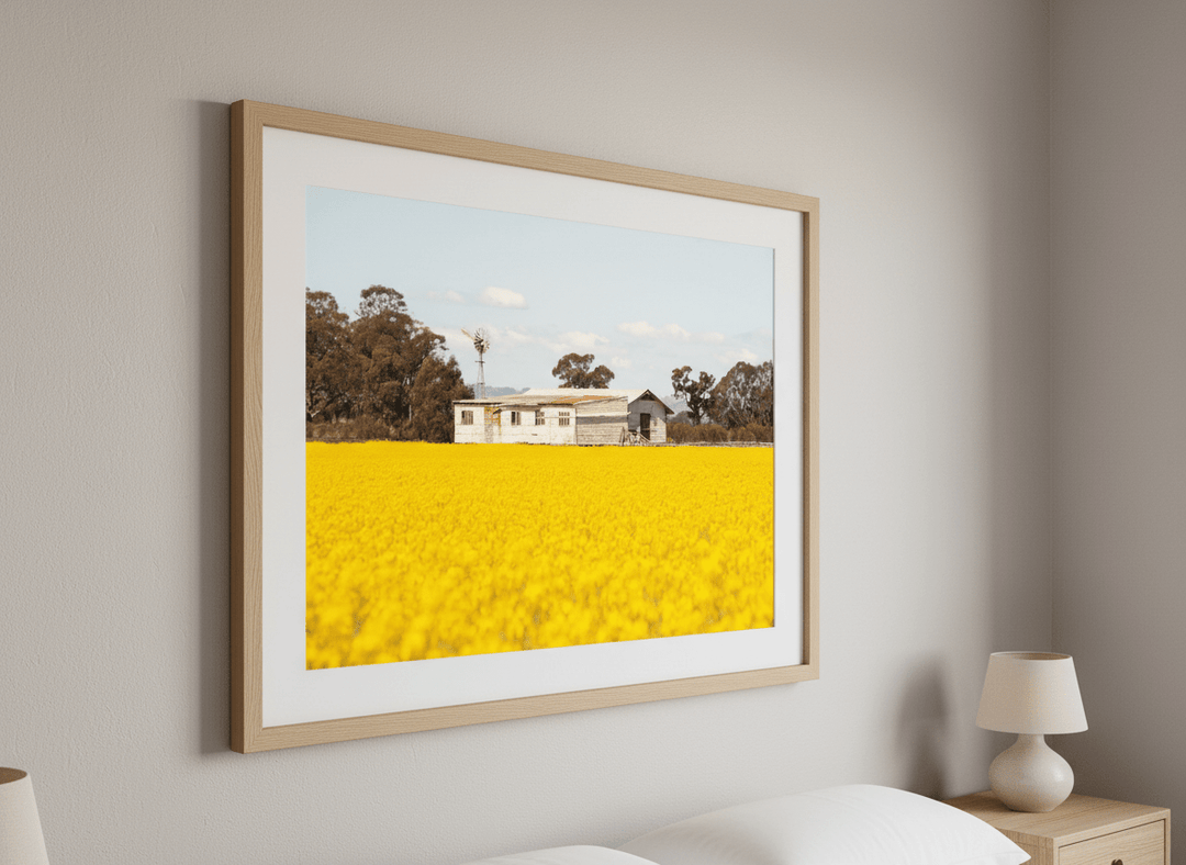 Minimalist artwork displayed in a calm, light-filled bedroom interior