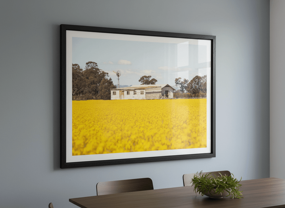 Wall art styled above a dining table in a contemporary home