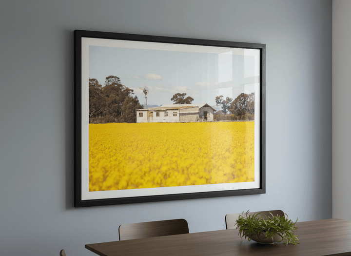 Wall art styled above a dining table in a contemporary home