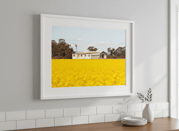 Artwork styled on the wall of a bright modern kitchen