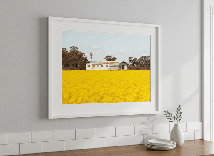 Artwork styled on the wall of a bright modern kitchen