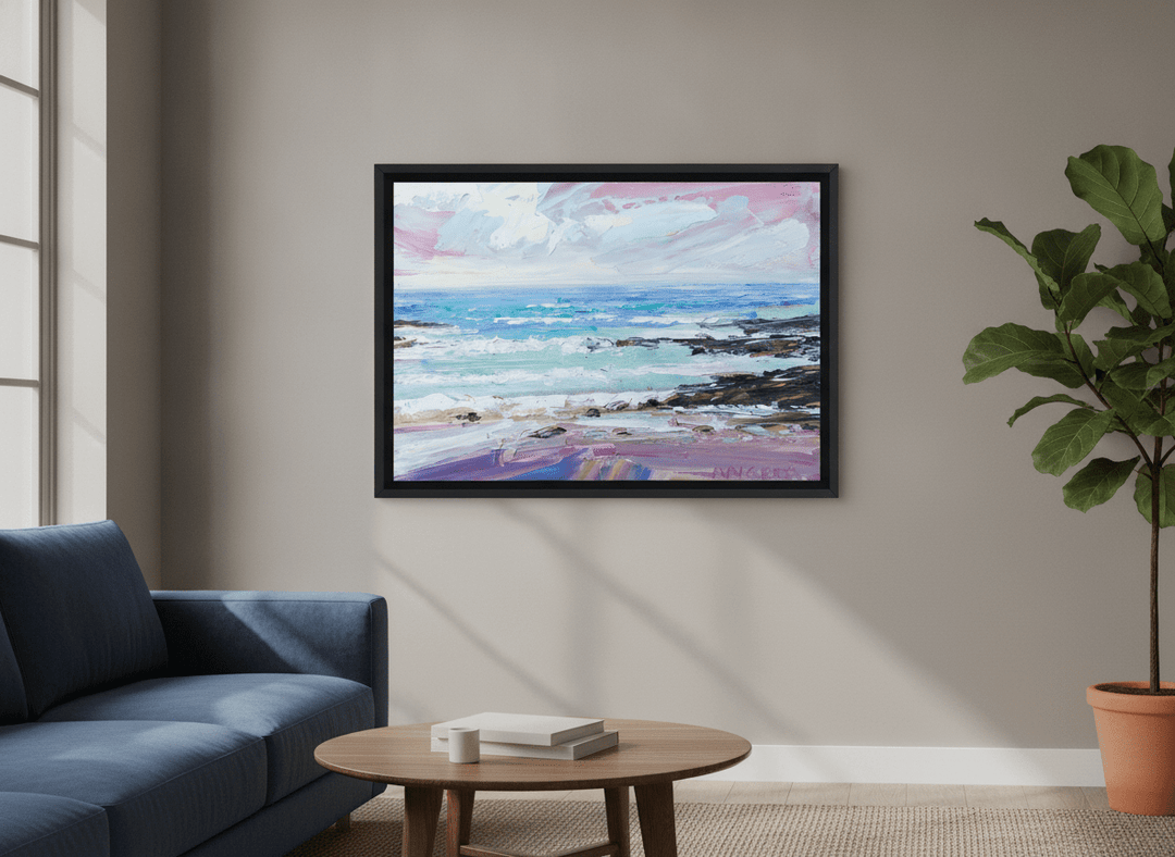 Modern wall art styled above a sofa in a neutral living room