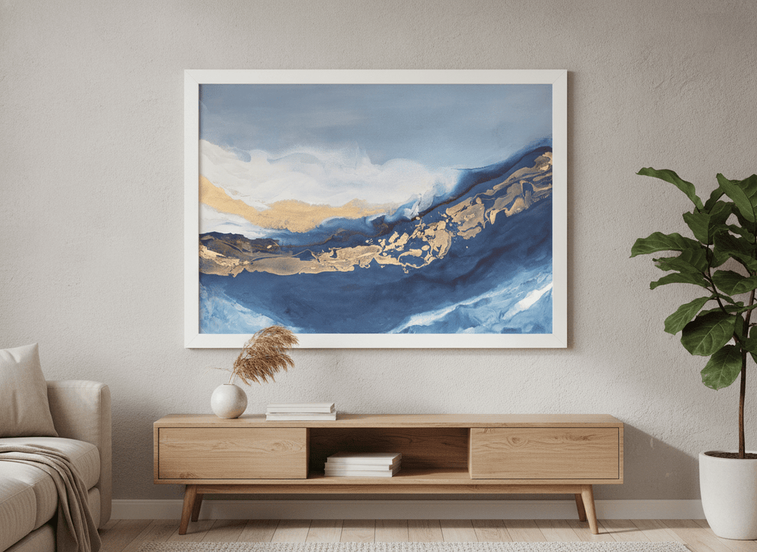 Modern wall art styled above a sofa in a neutral living room