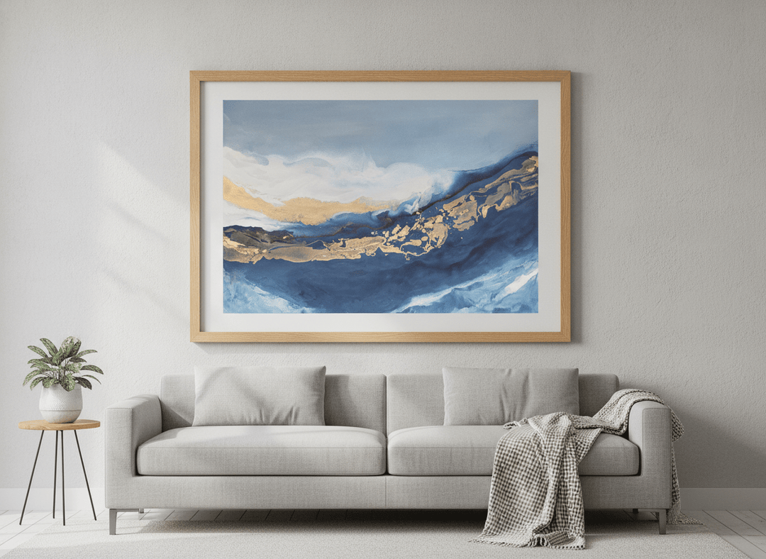 Modern wall art styled above a sofa in a neutral living room