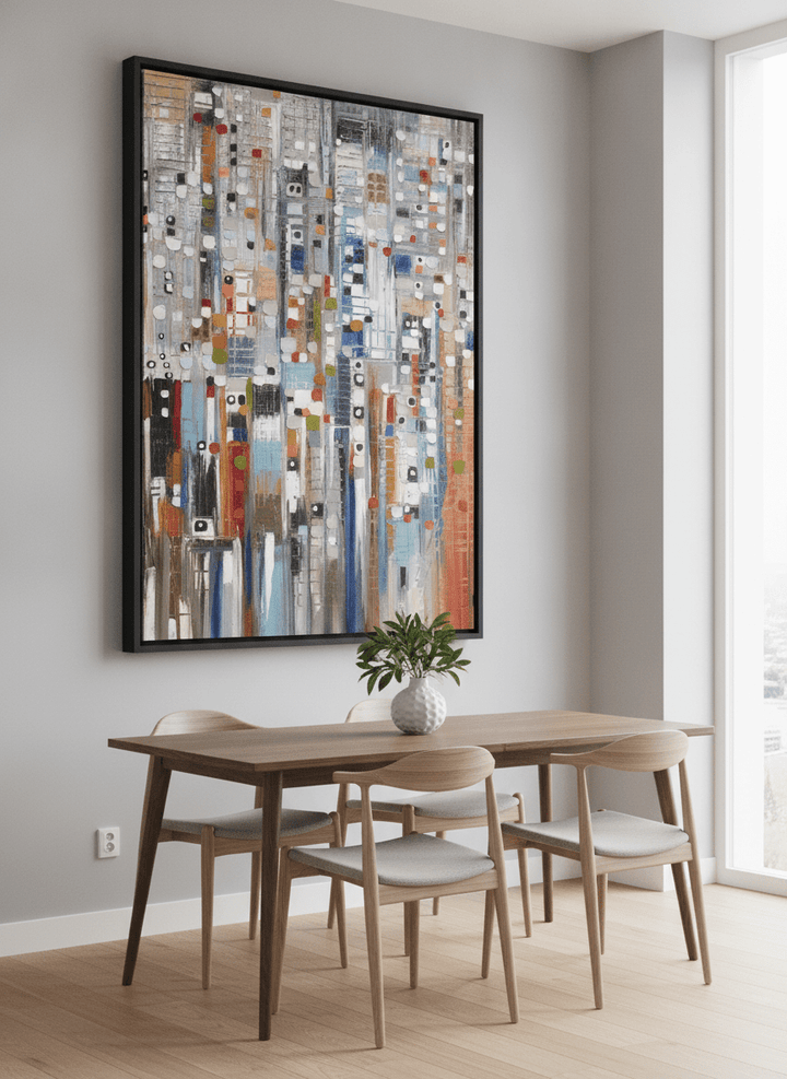 Wall art styled above a dining table in a contemporary home