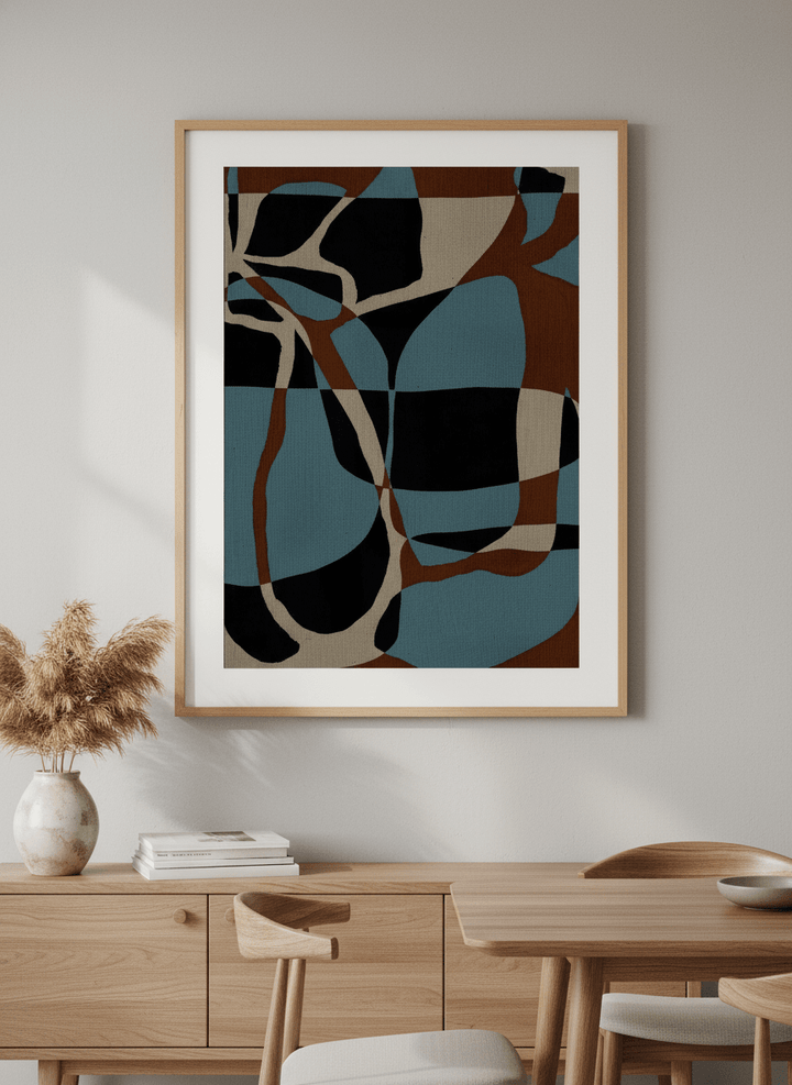 Wall art styled above a dining table in a contemporary home
