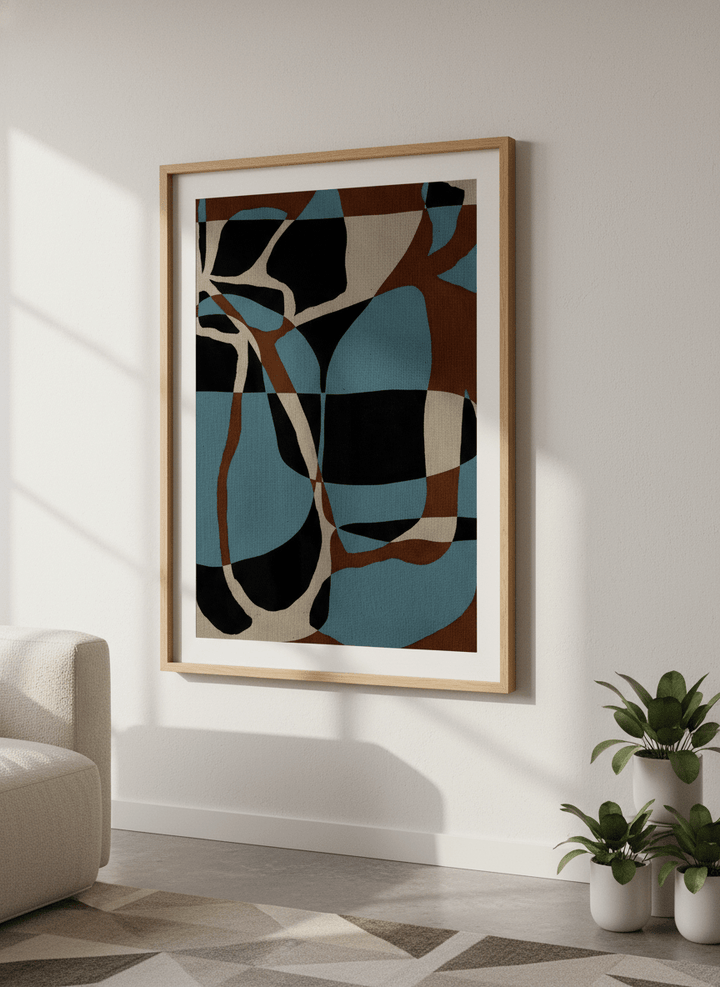 Modern wall art styled above a sofa in a neutral living room