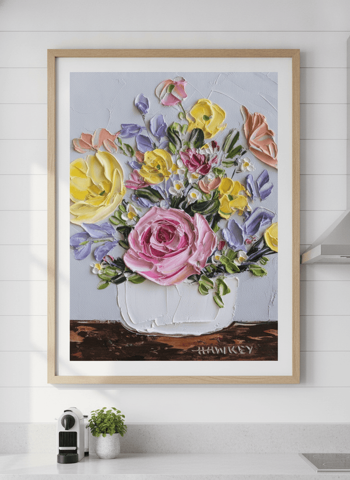 Artwork styled on the wall of a bright modern kitchen