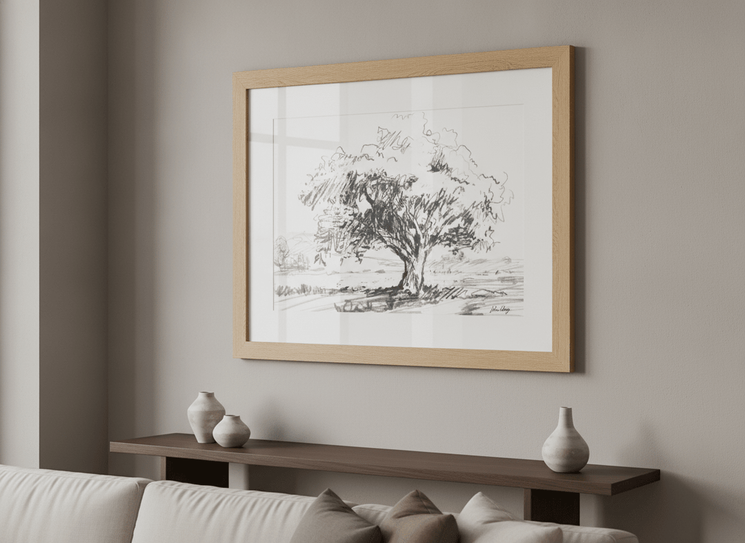 Modern wall art styled above a sofa in a neutral living room