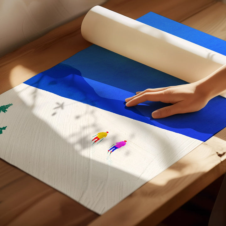 Hand rolling out a blue mat on a wooden floor with colorful figures underneath.