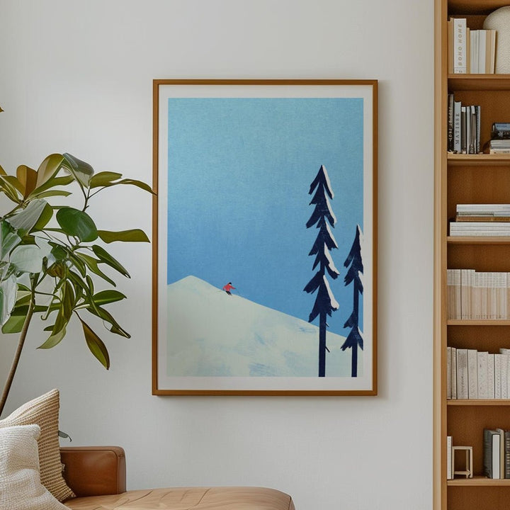 Modern living room with a brown leather sofa, bookshelf, and wall art.