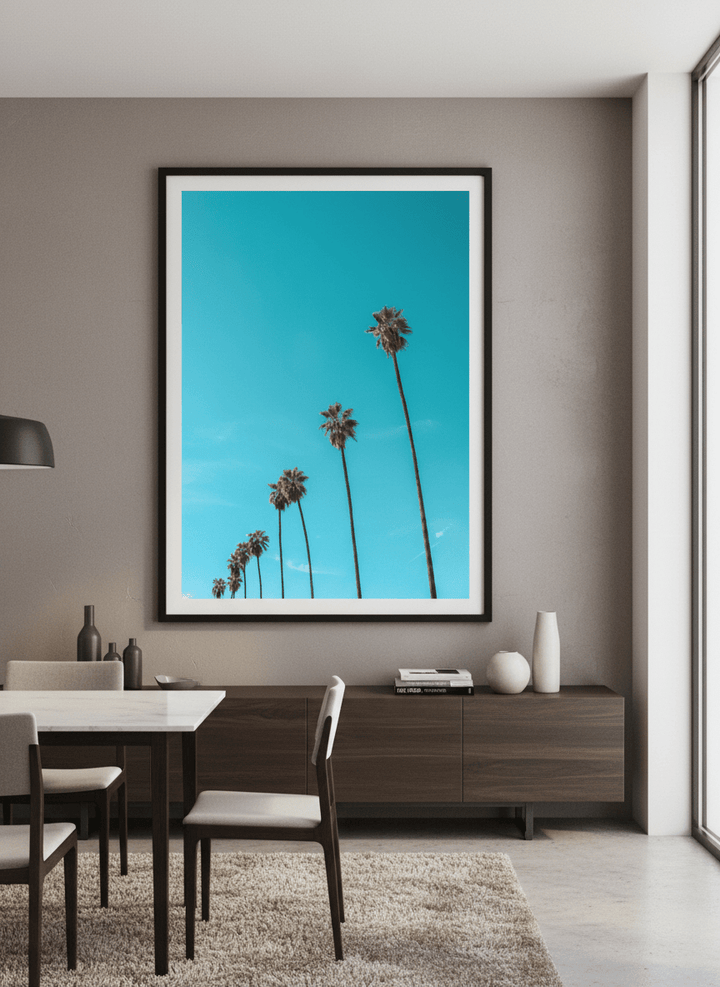Wall art styled above a dining table in a contemporary home