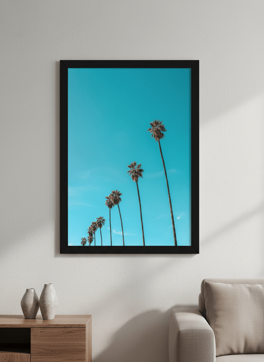 Modern wall art styled above a sofa in a neutral living room
