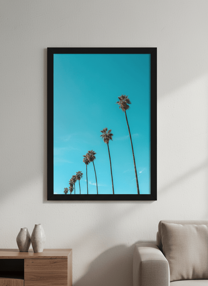 Modern wall art styled above a sofa in a neutral living room