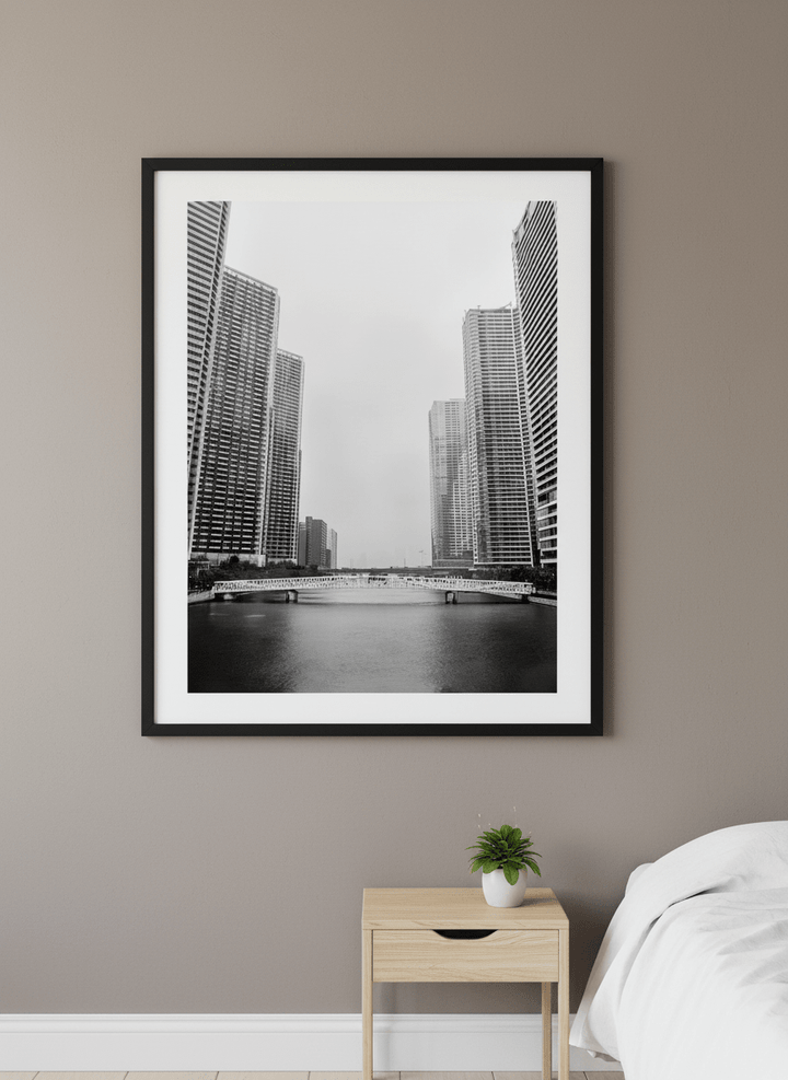 Minimalist artwork displayed in a calm, light-filled bedroom interior