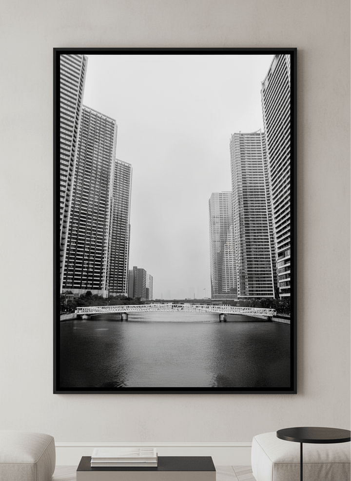 Modern wall art styled above a sofa in a neutral living room