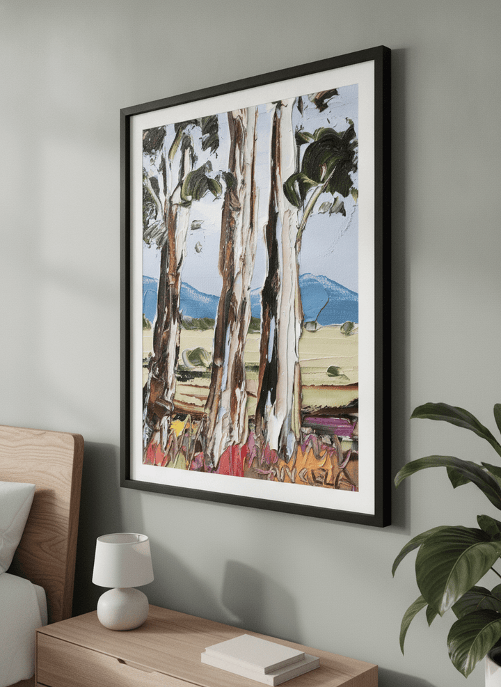 Minimalist artwork displayed in a calm, light-filled bedroom interior