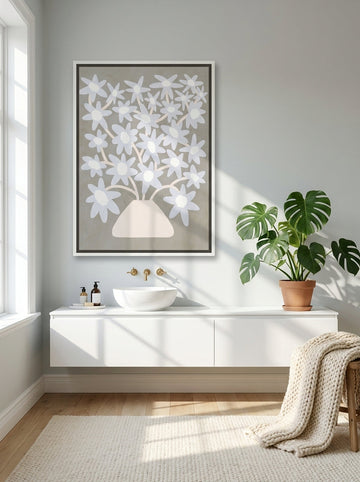 Oversized statement canvas wall art with a white surround styled on the wall in a bright Scandinavian bathroom