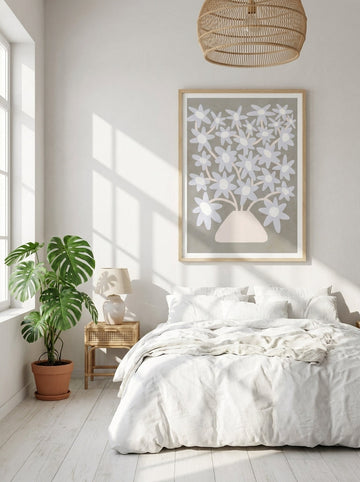 Modern wall art print styled on the wall in a bright Scandinavian bedroom
