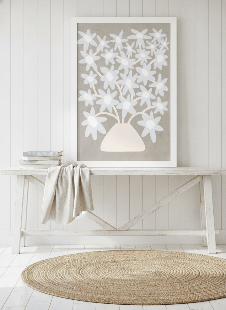Modern wall art print standing on a console in a coastal dining room