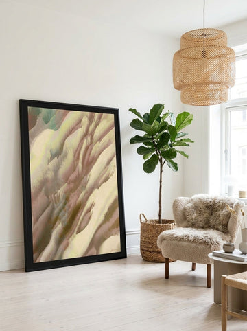 Oversized statement modern wall art print leaning against the wall in a bright Scandinavian living room