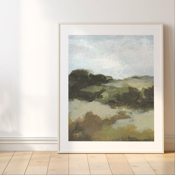 Landscape painting on a wall with a vase of dried plants on a wooden floor.