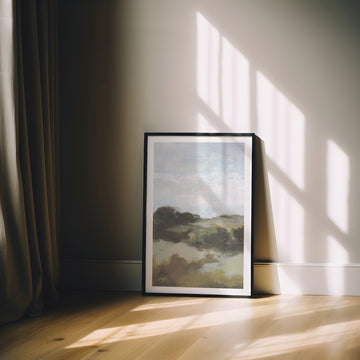 Landscape print on a wall with sunlight casting shadows