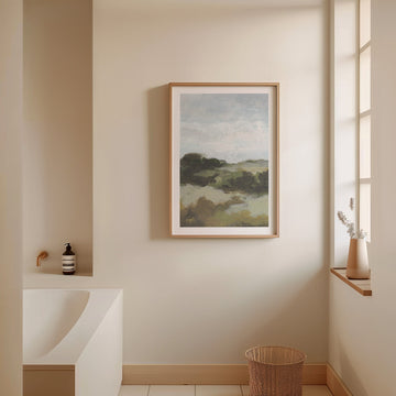 Landscape painting on a wall in a bathroom setting