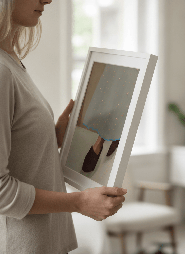 Person showcasing the artwork against a clean modern interior wall