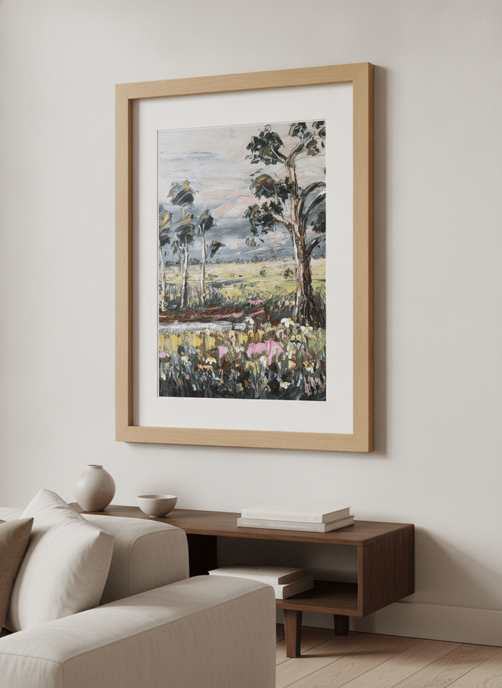 Modern wall art styled above a sofa in a neutral living room