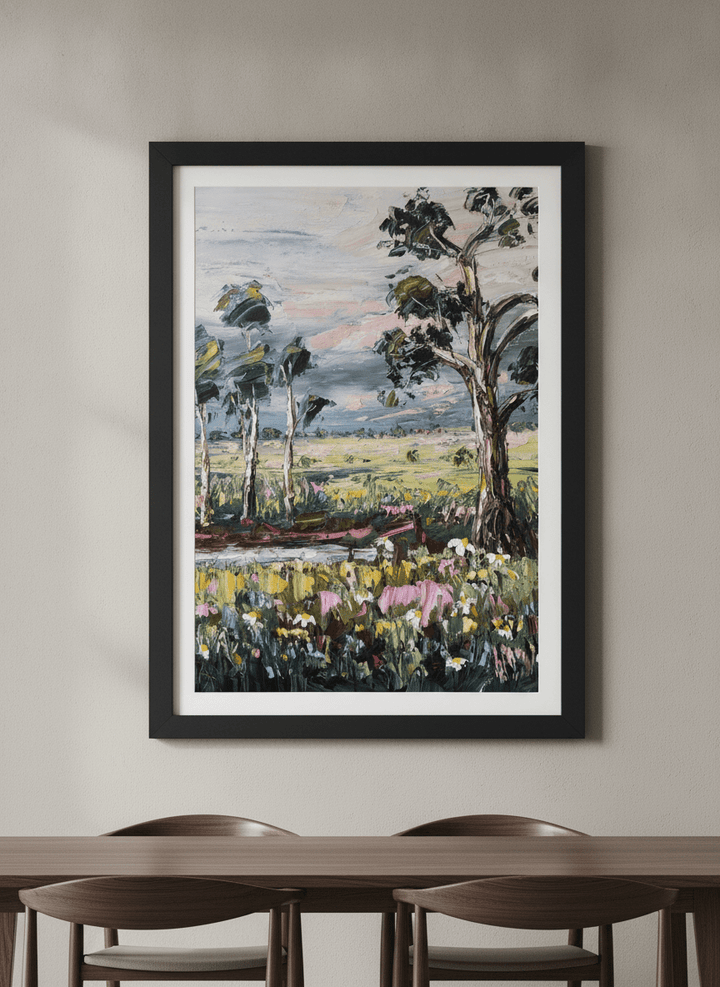 Wall art styled above a dining table in a contemporary home
